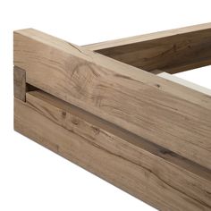 a close up of a wooden bed frame with no headboard or foot board on it