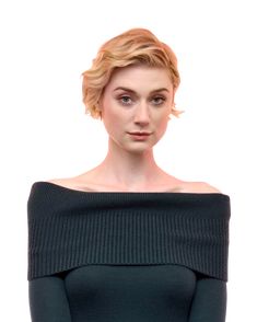 a woman with blonde hair wearing a black off the shoulder top