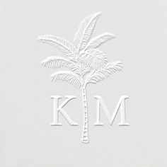 a white palm tree with the letter k m on it's front and bottom