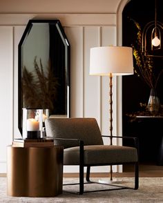 a living room with a chair, table and mirror in it's centerpiece