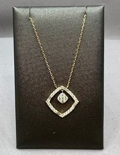 This diamond pendant is made up of baguette and round brilliant cut diamonds. The total diamond weight is 0.43 carats. The pendant is cast and assembled in 14kt Yellow Gold and is on a 14kt Yellow Gold chain with 2 stations that make the length adjustable. The pendant measures 15mmx15mmItem Number 160-00060 Luxury Wedding Diamond Necklace With Square Pendant, Luxury Square Pendant Diamond Necklace For Wedding, Luxury Brilliant Cut Diamond Necklace With Square Pendant, Luxury Square Pendant Diamond Necklace With Prong Setting, Luxury Elegant Diamond Necklace With Square Pendant, Luxury Single Diamond Square Pendant Necklace, Luxury Diamond Necklace With Square Brilliant Cut Pendant, Luxury Square Pendant Jewelry With Diamond Accents, Luxury Single Diamond Square Pendant Jewelry