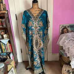 "Vintage 1970's 1980's caftan/kaftan. Beautiful pattern in Teal/Green/Black/Goldenrod Yellow. Made in India. The fabric is Viscose. Fabric has a silky feel. *SCROLL DOWN FOR CONDITION & MEASUREMENTS* CONDITION: I note a small opening in the front under the bust in the center (SEE PIX). This is where there WAS a drawstring. It would have been pulled to give it a high waistline. But the drawstring is missing. But certainly can be worn as it is. MEASURES: Bust~Approximately 54\" Hips~60\" Back of collar to bottom~52\" *WE APOLOGIZE~BUT WE NO LONGER SHIP TO GERMANY, ITALY OR SPAIN. IF ORDERS COME IN FROM GERMANY, ITALY OR SPAIN, WE WILL HAVE TO CANCEL THEM AND REFUND YOUR MONEY. SORRY FOR THIS INCONVENIENCE*" Goldenrod Yellow, Viscose Fabric, Teal Green, Dress Clothes For Women, Beautiful Patterns, 1970s, Dress Outfits, Spain, Bathing Beauties