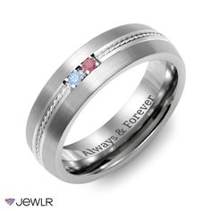 a wedding ring with three stones and engraving on the side, in white gold or silver