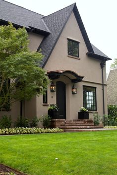 a house that has some plants in front of it