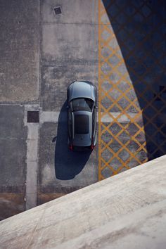 an overhead view of a car parked on the street