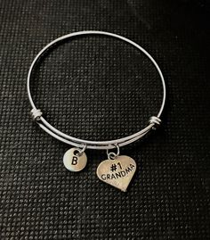 PERSONALIZED Grandma Bangle   Grandparent Grandma Jewelry   Grandmother Gift  We ship fast and you will be excited when you get get your #1 Grandma bangle bracelet.     I strive to have excellent customer service.  I do not include invoices in any packages unless requested, a note can be added to a recipient upon request as well having the item shipped directly to them.  Shipping: A flat rate in the United States, regardless of how many items purchased. Ships in 1 Business Day, but we do not shi Nana Bracelet, Grandma Jewelry, Grandma Bracelet, Grammy Gift, Perfume Locket, Grandmother Jewelry, Perfume Jewelry, Mothers Bracelet, Christmas Gifts For Grandma