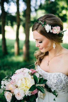 a woman in a wedding dress holding a bouquet