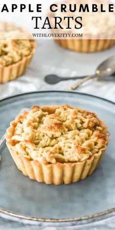 apple crumbled tarts on a plate with spoons and forks in the background