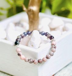 Purple iolite & pink rhodonite gemstone bracelet with silver hollow filigree beads 6mm. Iolite is connected to the third eye chakra, and promotes creativity. Pink rhodonite promotes emotional healing and improves self worth. Pink Rhodonite, Christmas Deals, Emotional Healing, Healing Crystal, Gemstone Bracelet, Third Eye, Boho Jewelry, Arm Band, Crystal Healing