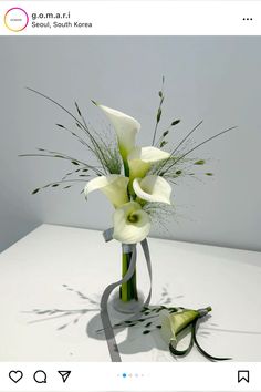 a white flower arrangement on a table