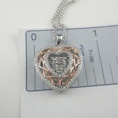 "Sterling Silver Celtic Dancing Stone & Heart Pendant with CZs Rose Gold Plate Celtic Knot with CZ Trim Shimmering Dancing Stone Center 1\" long x 3/4\" wide including bale Adjustable Sterling Silver chain 18\" or 20\" Chain and Pendant 6.3 grams; pendant only 3.2 grams In Stock! Ships Immediately. Celtic Damhsa CZ Pendant Damhsa is Dancing in Gaelic Pronunciation of the word \"Damhsa\" is \"Dow-sa\" Made in Ireland by Boru Ships Free within the USA 21 Day Returns Items must be returned in n Box Chain Necklace For Mother's Day Anniversary, Rose Gold Heart Necklace With Adjustable Chain For Anniversary, Mother's Day Rose Gold Heart Necklace With Cubic Zirconia, Anniversary Rose Gold Heart Necklace With Adjustable Chain, Mother's Day Anniversary Box Chain Necklace, Anniversary Jewelry With Cubic Zirconia Box Chain, Cubic Zirconia Box Chain Necklace As Gift, Cubic Zirconia Box Chain Necklace For Gift, Gift Necklace With Cubic Zirconia And Box Chain