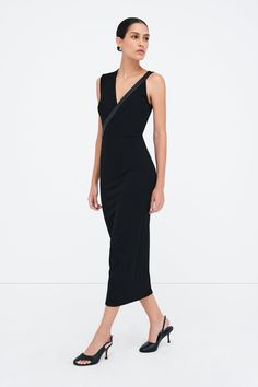 Dress outside the lines with our Carlton Dress, an elegantly unique sheath silhouette. Her asymmetrical design features one wide shoulder and a slender faux leather strap (wide enough to conceal bra straps) that continues down to define her waist. Crafted from structured, mid-stretch European ponte with a hidden side zip for easy on/off. [SPLIT] Astrid is 5'9" (175 cm) tall, wearing size XS. Total length approximately 49.5" (125.5 cm). European Ponte, also known as Punto di Roma (60% Viscose, 30 Sleek Black One-shoulder Midi Dress, Elegant Dress With Strap Detailing For Date Night, Elegant Strap Detailed Dress For Date Night, Structured Black Party Dress, Elegant One-shoulder Midi Dress For Going Out, Elegant One Shoulder Midi Dress For Going Out, Black Structured Party Dress, Chic Evening Dress With Strap Detailing, Fitted Black Dress With Strap Detailing