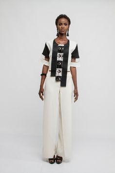 White crepe pants with front slits Wear with: Assymetrical crop top available in white or black Crepe Pants, Western Outfit, African Prints, Western Outfits, Leather Design, African Print, Leather Purses, Dress Skirt, Shirt Dress