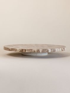 a white marble plate sitting on top of a table