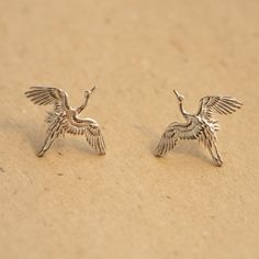 This unique crane stud earring is made of high-quality Sterling Silver and a perfect addition to your eccentric jewelry collection.  Cranes are an important motif in Chinese mythology. In Chinese culture, the crane is venerated as the prince of all feathered creatures and thus has a legendary status. Embodying longevity, peace, wisdom, and nobility, it is the second most favored bird symbol after the phoenix. Throughout the imperial times, crane motifs were used on the robes of civil officials t Bird Earring, Fantasy Earrings, Hummingbird Earrings, Cool Piercings, Crane Bird, Flying Bird, Ear Pins, Earrings Antique, Snake Jewelry