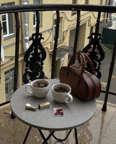 two cups of coffee on a small table