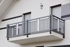 an apartment building with balcony and balconies