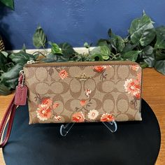 Nwot Coach Flower Double Zipper Wristlet Signature Canvas With Floral Print Gold Tone Hardware 2 Half Zipper Compartments Maroon Fabric Lining 1 Side Has 2 Slip Pockets 2nd Side Has 1 Slip Pocket And 6 Credit Card Holders Phone Will Fit Either Side Msrp $198 Smoke-Free Home A464 Spring Travel Wristlet With Zipper Closure, Beige Wallets For Spring, Clutch Wristlet With Zipper Closure, Beige Wristlet With Zipper Closure For Travel, Spring Wristlet With Zipper Closure In Pouch Shape, Spring Wristlet With Zipper Closure For Daily Use, Spring Wristlet With Zipper For Daily Use, Spring Pouch Wristlet With Zipper Closure, Spring Wristlet With Zipper Closure