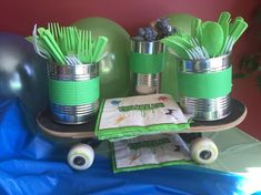 a table topped with green plastic cups filled with toothbrushes