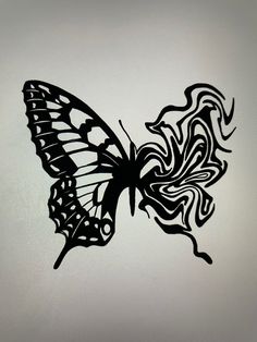 a black and white drawing of a butterfly