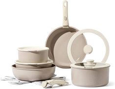 an assortment of pots and pans on a white background