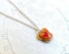 "This is a really cute peanut butter and strawberry jelly necklace. The charm is made of polymer clay. :) Choose either a silver plated, gold plated, rose gold plated, surgical stainless steel, or sterling silver chain (stainless steel and sterling silver are especially good for those with metal sensitivities). The peanut butter/jelly charm is approx. 3/4\", but can vary slightly since they're handmade. :) **As these are handmade, there will be slight variations. **Please note, that if you buy t Sweet Nickel-free Jewelry For Gifts, Sweet Nickel-free Jewelry Gift, Sweet Handmade Jewelry For Valentine's Day, Sweet Handmade Resin Jewelry, Handmade Sweet Resin Jewelry, Handmade Resin Jewelry In Sweet Style, Sweet Style Valentine's Day Jewelry Gift, Valentine's Day Sweet Style Jewelry Gift, Sweet Valentine's Day Jewelry Gift