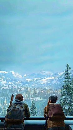 two people sitting on a bench looking out at the snow covered mountains and trees in the distance