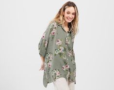 The Teddie linen shirt is an oversized, one-size fabulous top that doubles as a jacket if you leave it unbuttoned.This shirt looks equally stunning on a slim petite person as it does on full size 24.Easy to wear, comfortable, stylish, and beautiful. You will want to own more than one. Oversized Casual Floral Print Blouse, Spring Linen Blouse With Floral Print, Oversized Khaki Blouse For Spring, Oversized Floral Print Top For Daywear, Oversized Floral Print Button-up Blouse, Linen Floral Print Blouse For Daywear, Daywear Linen Blouse With Floral Print, Linen Blouse With Floral Print For Daywear, Vacation Linen Blouse With Floral Print