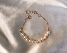 Our Braided Pearl Chain bracelet is such a unique piece to add to your jewelry collection! It is wire braided, made with vintage pearls and connected to a chain clasp. We love this piece.