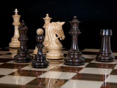 a chess board with several pieces on it