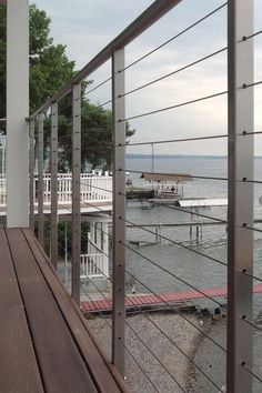 a wooden deck overlooks the water and dock