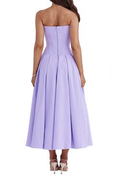 All eyes will be on you in this lilac-hued dress built with a sculpted boned bodice, molded butterfly neckline and a voluminous skirt buoyed by layers of tulle. Exclusive retailer Hidden back-zip closure Sweetheart neck Strapless Side-seam pockets Lined, with tulle crinoline underskirt 65% Richcel viscose, 35% polyester Dry clean Imported Purple Corset-back Dress For Gala, Purple Dress With Corset Back For Gala, Purple Gala Dress With Corset Back, Purple Corset Back Dress For Gala, Lavender Dress With Fitted Bodice, Purple Evening Dress With Corset Back, Purple Sleeveless Corset Dress For Evening, Lavender Fitted Evening Dress, Lavender Evening Dress With Fitted Bodice