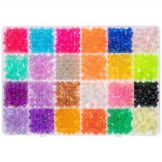 colorful beads are arranged in rows on a white background