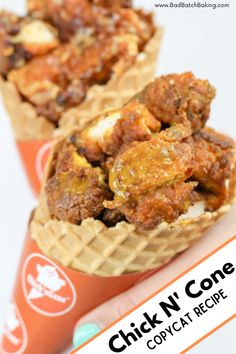 two cones filled with food sitting on top of each other