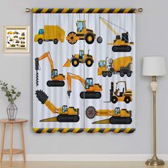 a curtain with construction vehicles printed on it