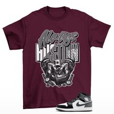 Hustle Jordan 1 Mid Iron Grey Sneaker Matching Tee Shirt Burgundy  The unisex heavy cotton tee is the basic staple of any wardrobe. It is the foundation upon which casual fashion grows. All it needs is a personalized design to elevate things to profitability. The specially spun fibers provide a smooth surface for premium printing vividity and sharpness. No side seams mean there are no itchy interruptions under the arms. The shoulders have tape for improved durability. .: 100% cotton (fiber conte Hip Hop Cotton Shirt With Text Print, Hip Hop Style Cotton Shirt With Text Print, Hip Hop Cotton Shirt With Logo Print, Urban Cotton Shirt Pre-shrunk, Urban Cotton Pre-shrunk T-shirt, Air Jordan Retro 9, Unique Sneakers, Sneaker Match Tees, Matching Tees