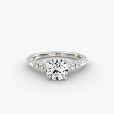 a white gold engagement ring with diamonds on the side