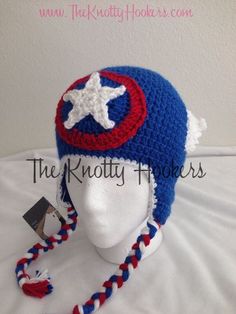 a crocheted captain america hat is on display