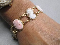 "Such an exquisite cameo bracelet! This one is rather rare, 6 beautiful genuine hand carved cameos are the focal point of this stunning piece. It is vintage 50's/60's Van Dell, new old stock, in excellent vintage condition. Well made in 12kt. gold filled to last for many years to come! It is 7 1/4\" long and 3/4\" wide. A double locking alligator clasp for security. Six different genuine shell cameos interlocking with polished gold, just gorgeous. Of course it is hallmarked Van Dell, and 12kgf. Heirloom Wedding Rings, Cameo Bracelet, Silver Emerald Ring, Cameo Jewelry, Vintage Cameo, Blowout Sale, Bracelet Vintage, Signet Ring, Chain Link Bracelet