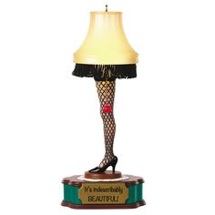 a lamp that has a woman's legs and stockings on it with the words beautiful