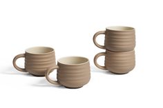 three coffee mugs sitting next to each other