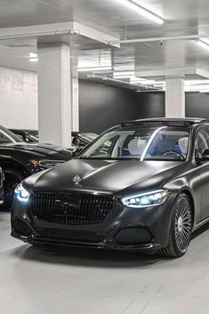 several cars are parked in a parking garage