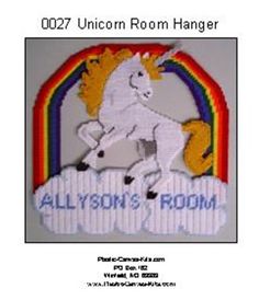 a cross stitch pattern for a unicorn room hanger