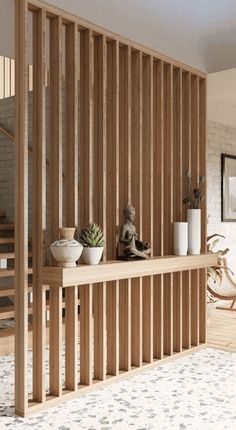 a room with wooden slats on the wall and plants in vases on the shelf