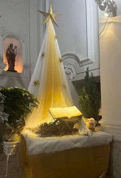 a christmas tree with lights and decorations in a room