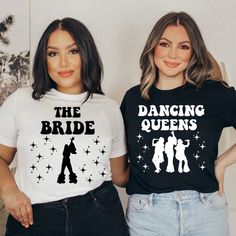 two women standing next to each other wearing matching t - shirts that read the dancing queens