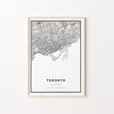 a framed map of toronto, canada in black and white with the words toronto on it