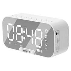 an alarm clock is shown with the time displayed on it's display screen,