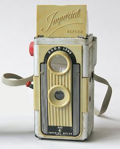 an old fashioned camera has been used as a decoration