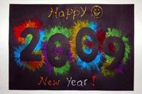 a happy new year card with the numbers 2009 painted in bright colors on black paper